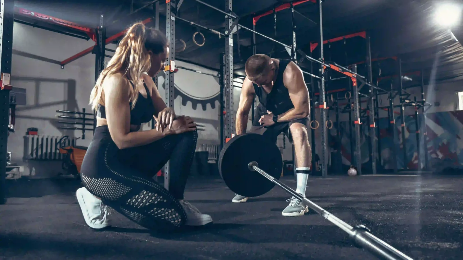 athletic-man-woman-with-dumbbells